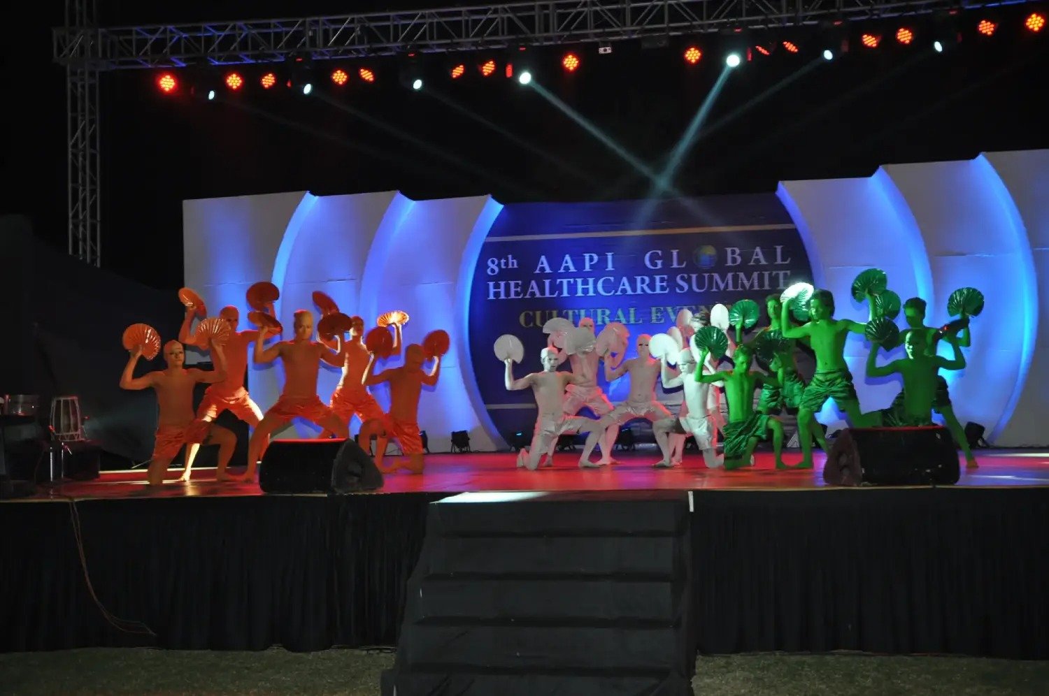 Man in suit speaking at podium with ITT logo on podium