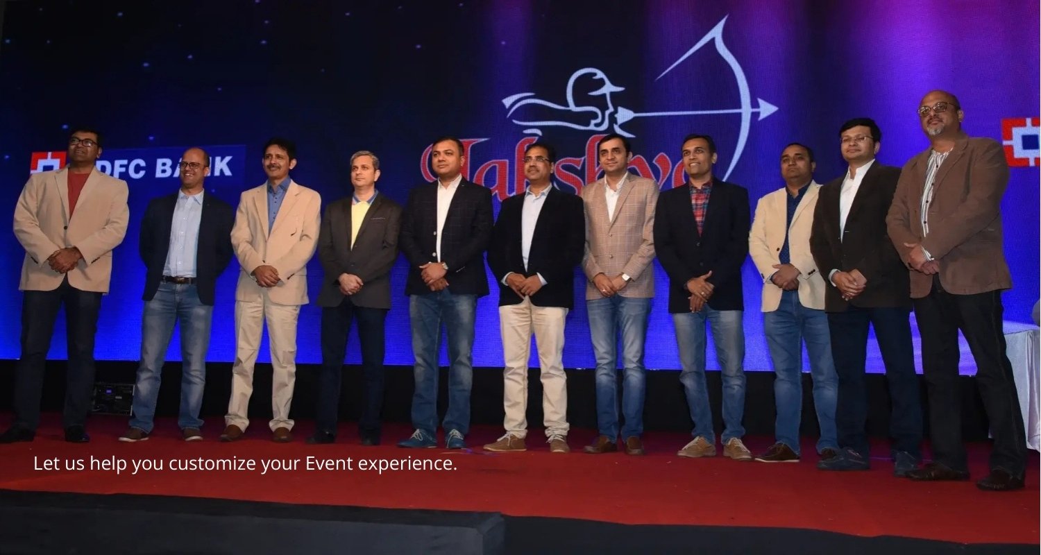 Elegant wedding setup with floral decorations and seating, white chairs and pastel flowers on tables, soft natural lighting, outdoor garden style