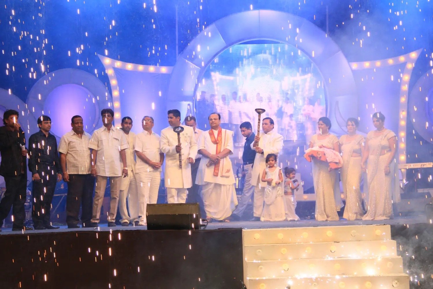 Product Launches with group of people on stage and blue lighting