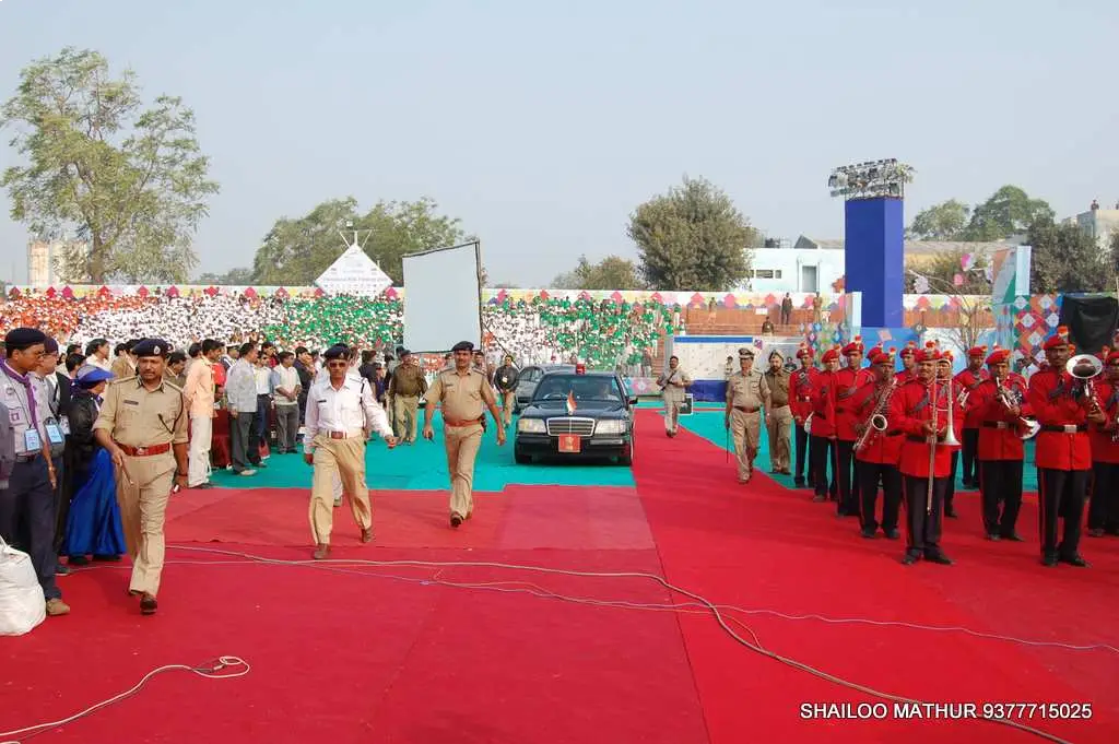 Festival Celebrations with people dancing on stage and colorful lighting