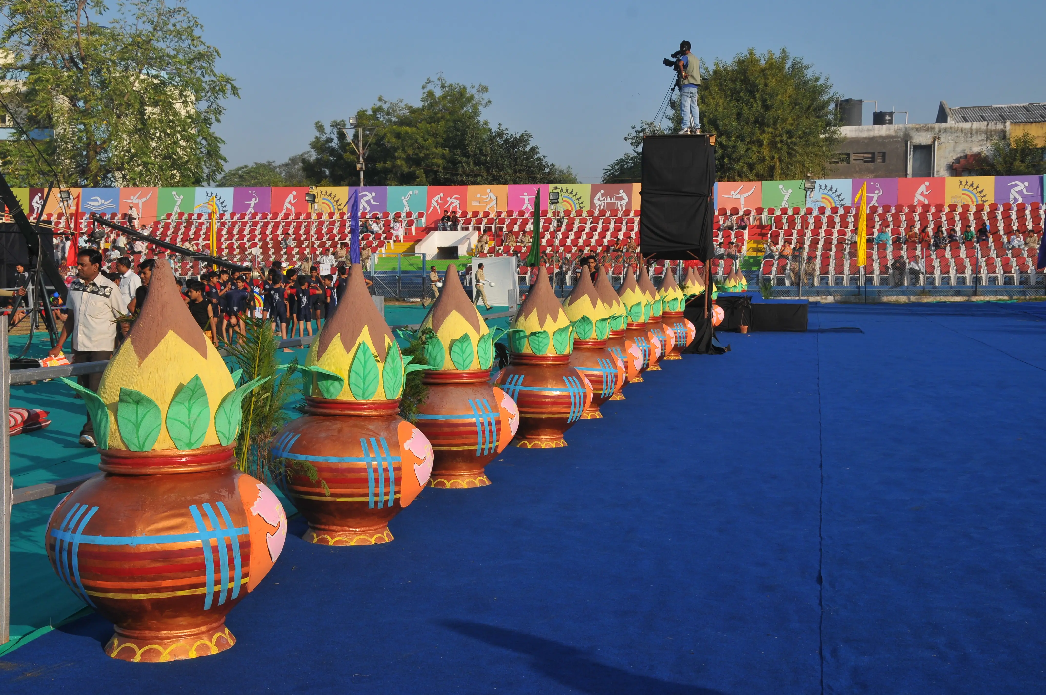 ITT event entrance with red and green carpet and pink lighting on white structure with ITT branding