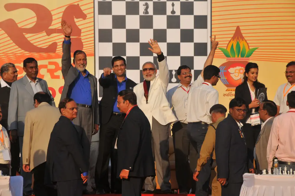 Men lighting ceremonial lamp at event with ITT banner in background