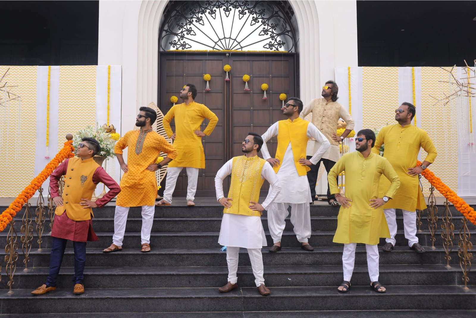 ITT event entrance with red and green carpet and pink lighting on white structure with ITT branding