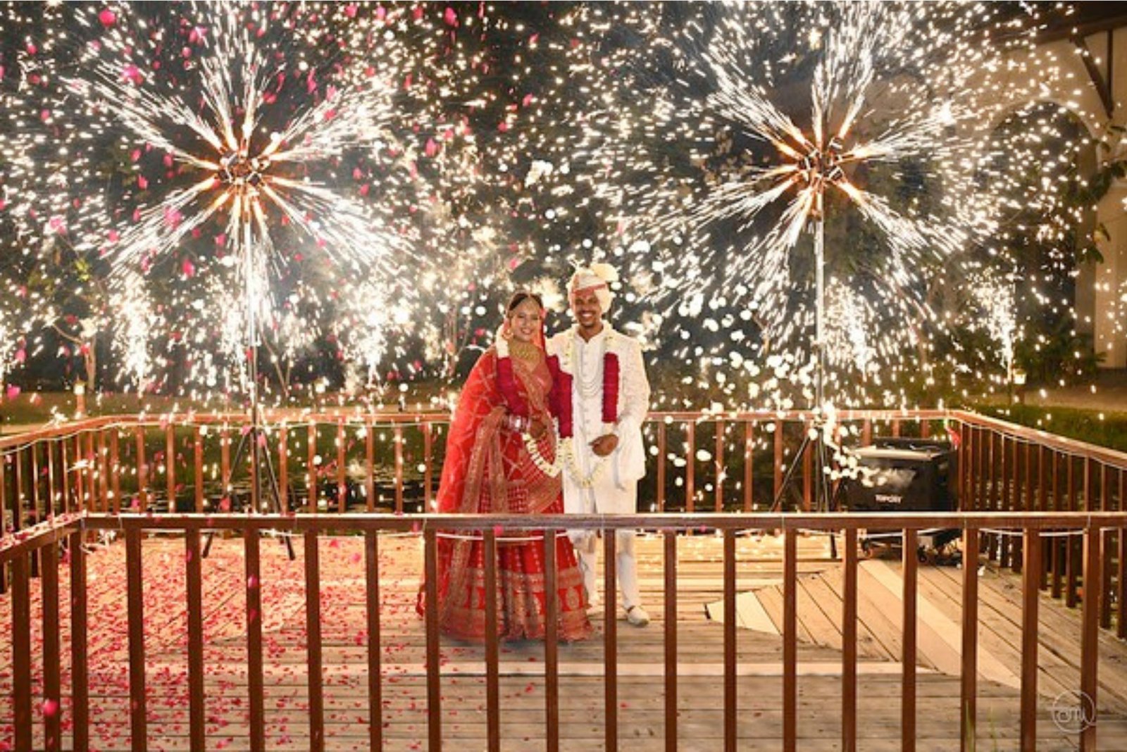 ITT event entrance with red and green carpet and pink lighting on white structure with ITT branding