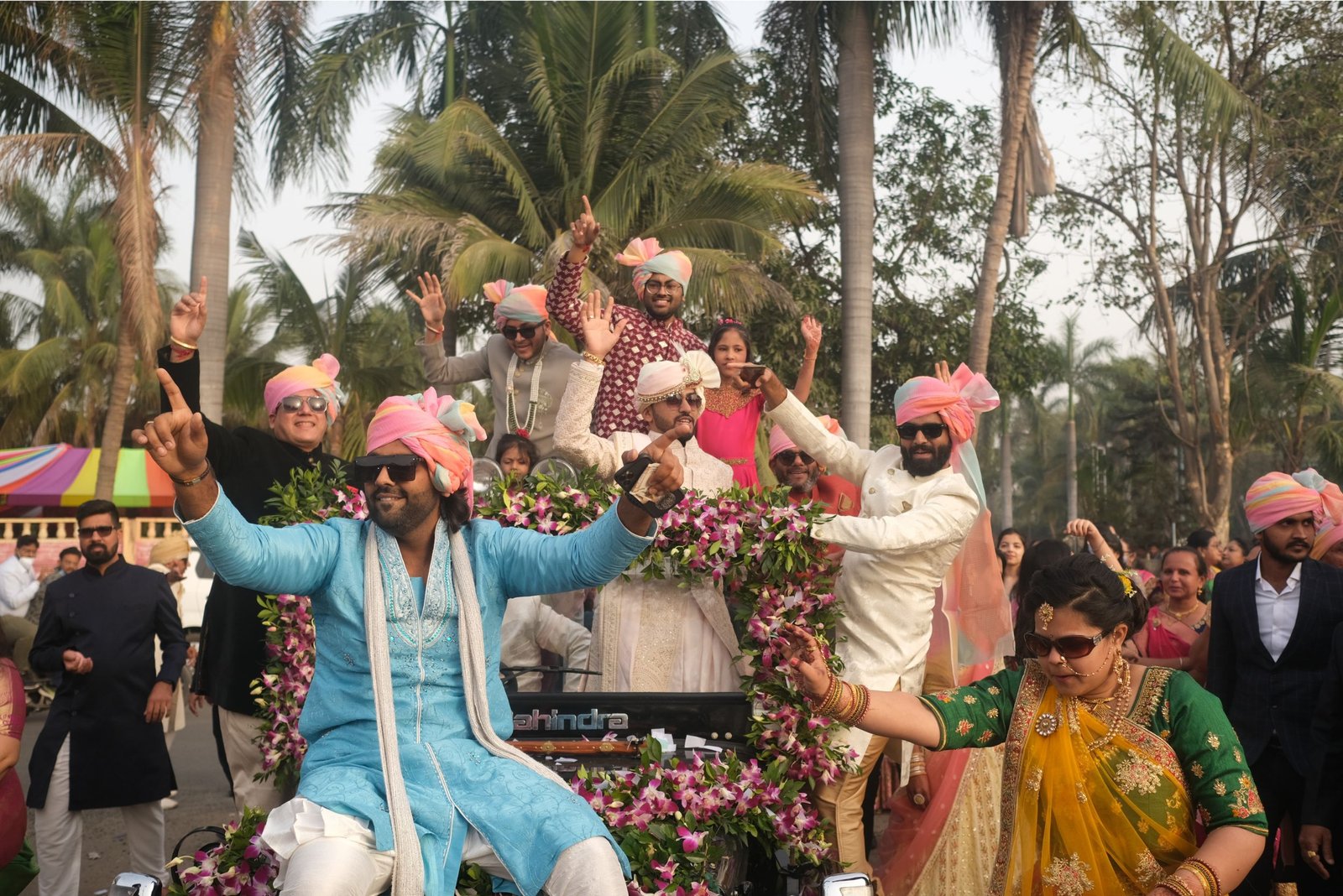 Men lighting ceremonial lamp at event with ITT banner in background