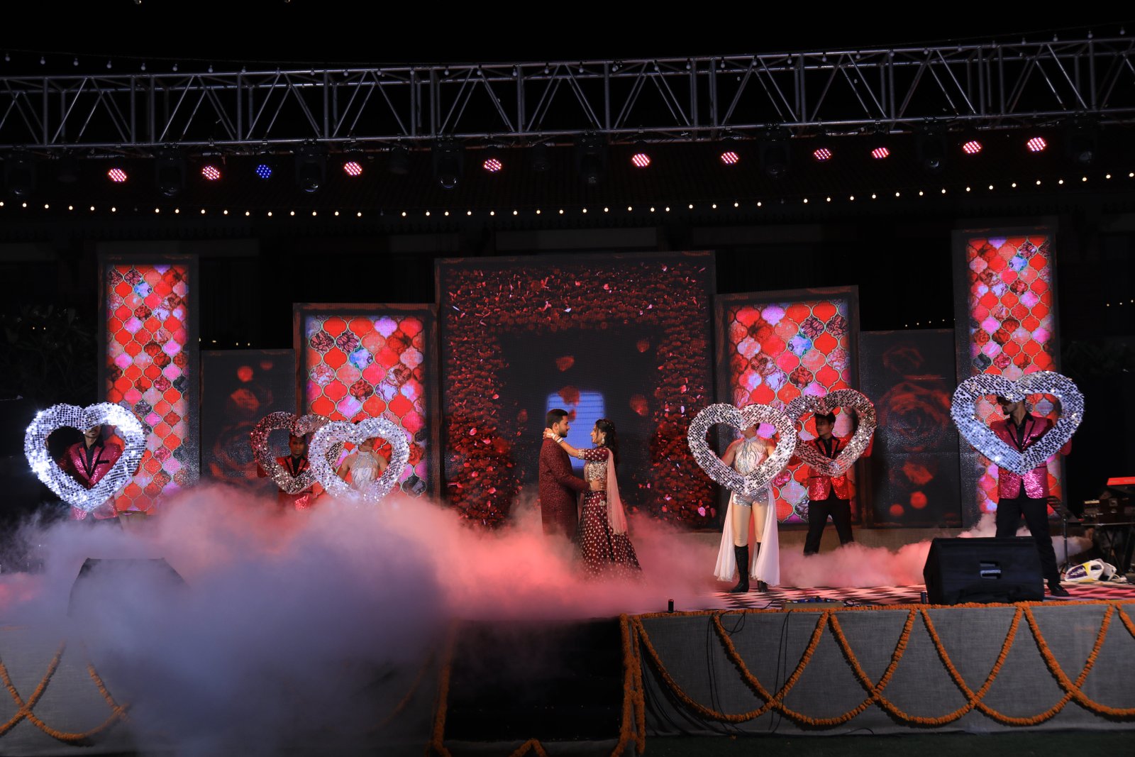 Conferences with people presenting awards and flags in background